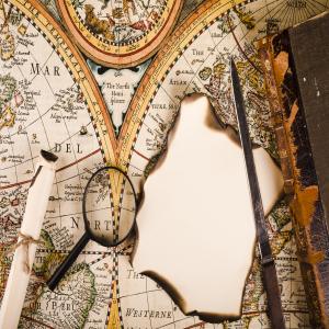 Elevated View Magnifying Glass Burnt Paper Knife Map